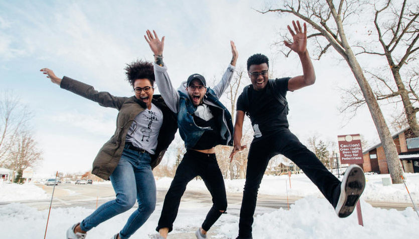 Friends having fun playing a music quiz game at a party